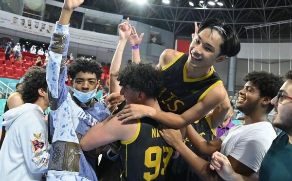 Basketball team of AIS, one of the top Abu Dhabi schools, celebrating their victory after a match
