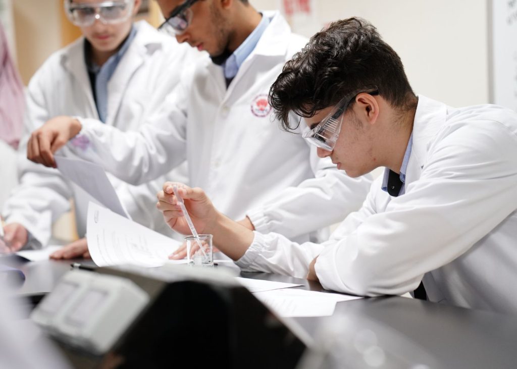Student of AIS, one of the top high schools in Abu Dhabi, at the science lab